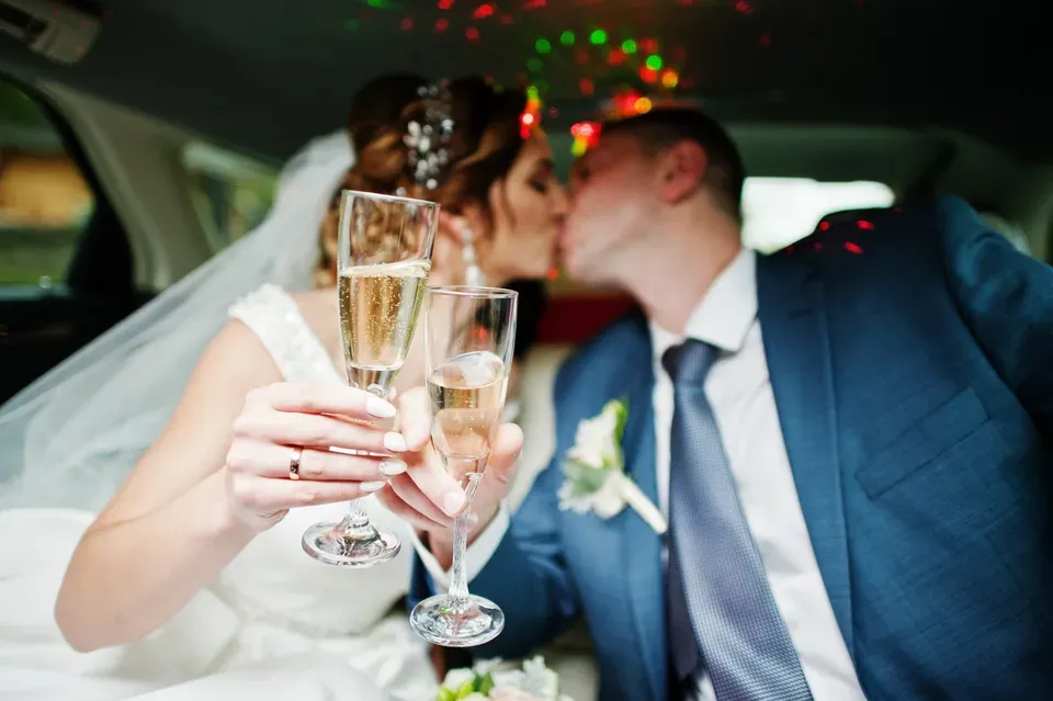 Couple Drinking Champagne in The Limousine — Ceres, CA — Luxury Limousine