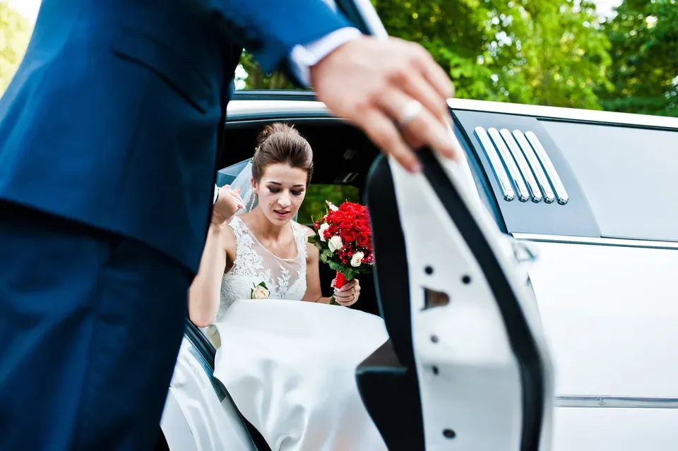 Groom Opening The Door Of Limousine — Ceres, CA — Luxury Limousine