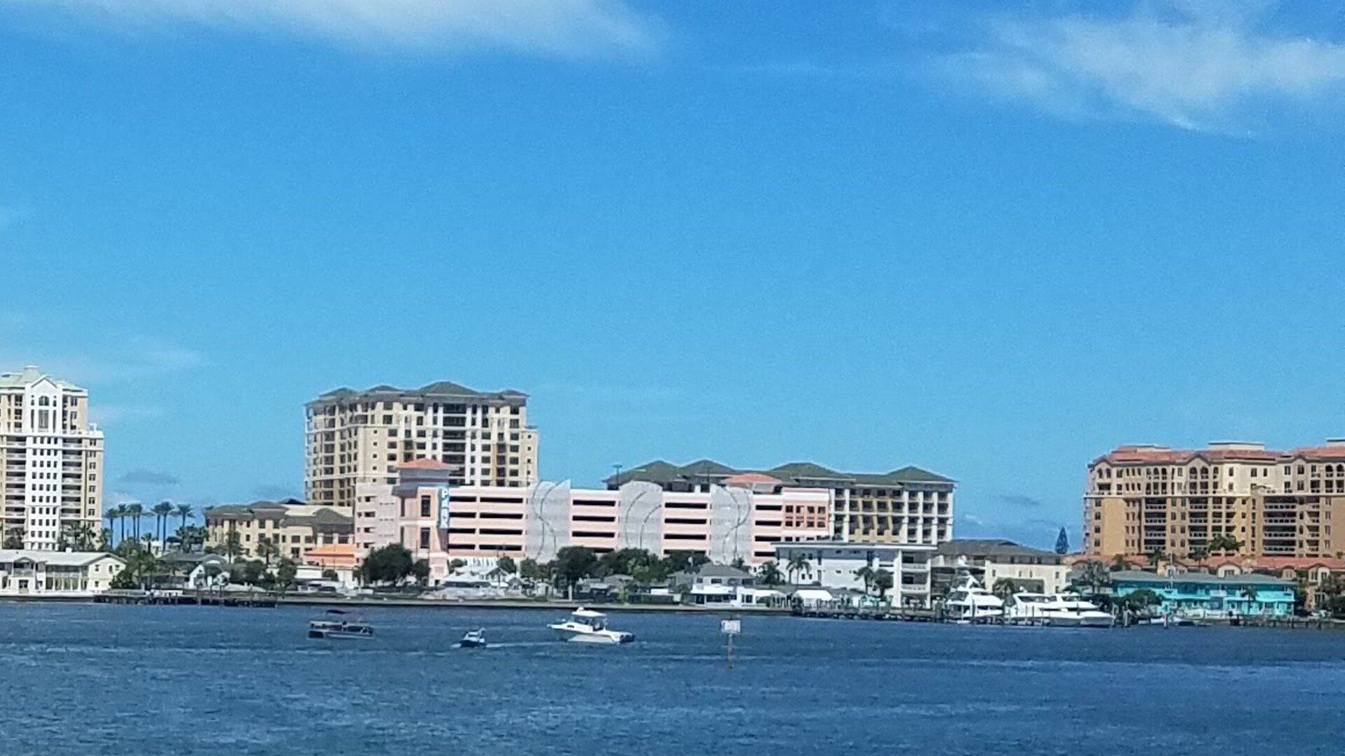 A large body of water with a city in the background