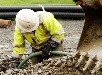 Utility Construction — Worker Digging the Ground in Egg Harbor Township, NJ