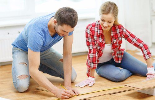 Expert measuring before cutting the wood