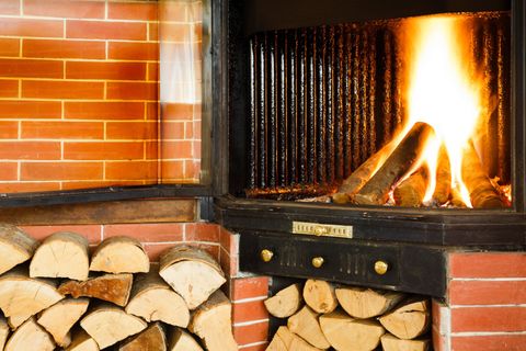 Wood Stove — Wood Fire Burning in a Chimney Insert in Madison, Wisconsin Wood Stove — Wood Fire Burning in a Chimney Insert in Madison, Wisconsin