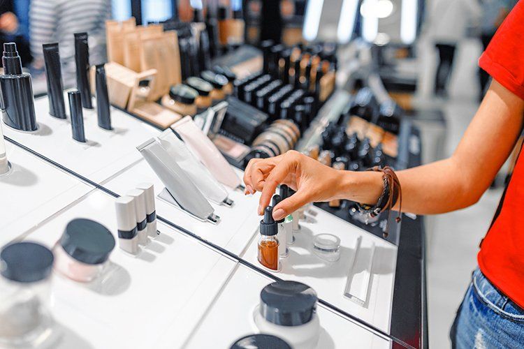 Woman Choosing Cosmetics — Greenwood Village, CO — Beau Visage Skin Care & Spa