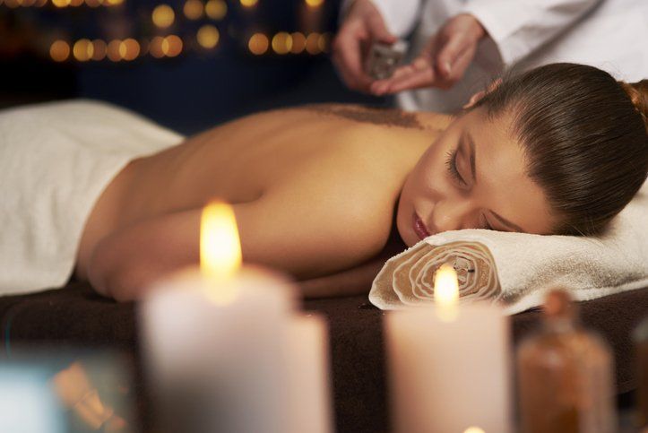 Woman Getting a Salt Scrub — Greenwood Village, CO — Beau Visage Skin Care & Spa Woman Getting a Salt Scrub — Greenwood Village, CO — Beau Visage Skin Care & Spa