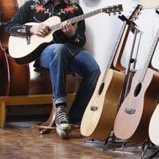 boy strumming the guitar