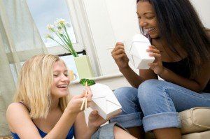 college roommates enjoying take-out