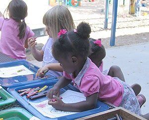 Children coloring with crayons at table — Children's Center in Lakewood,, CA