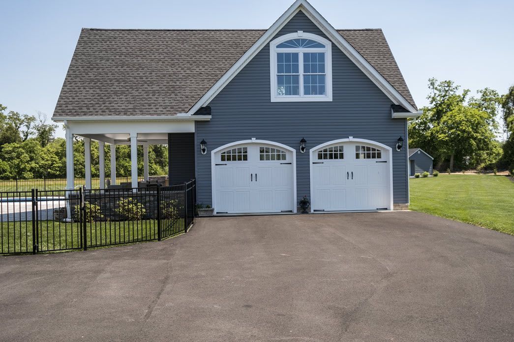 Blue home exterior with garage | Bay to Beach Builders | Greenwood, DE 19950