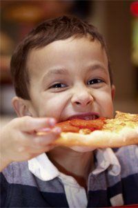 Kid Eating Pizza — Columbus, OH — Plank's Cafe & Pizzeria Kid Eating Pizza — Columbus, OH — Plank's Cafe & Pizzeria