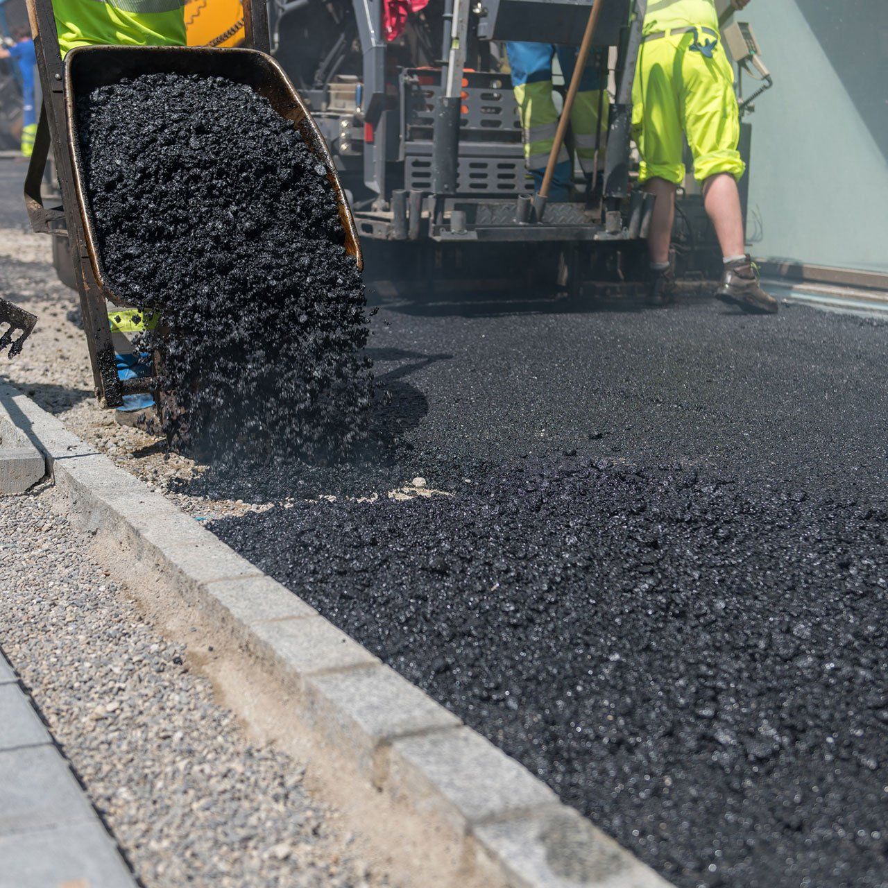 Asphalt is Unloaded from a Wheelbarrow — Wheat Ridge, CO — 5280 Asphalt Paving Contractors