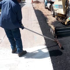 Asphalt is Unloaded from a Wheelbarrow — Wheat Ridge, CO — 5280 Asphalt Paving Contractors