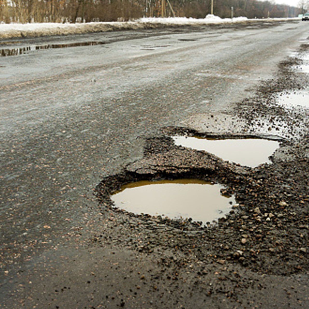 Old Road Patholes — Wheat Ridge, CO — 5280 Asphalt Paving Contractors Fix Road Pat holes — Wheat Ridge, CO — 5280 Asphalt Paving Contractors