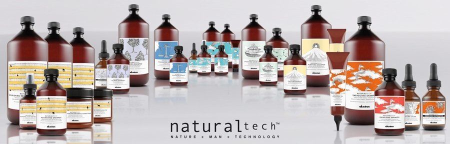 A bunch of bottles of natural tech products are lined up in a row