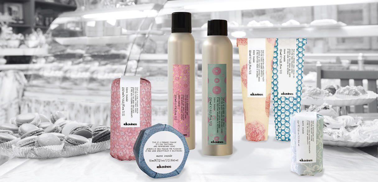 A group of hair products are sitting on a table in a store.