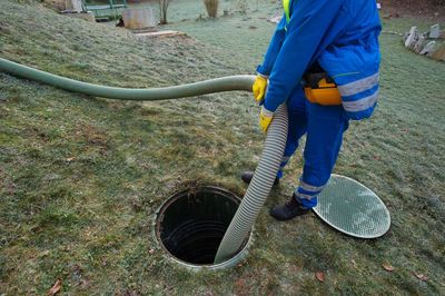 Septic Installation — Sewerage Worker In The Manhole in Lebanon, TN Septic Installation — Sewerage Worker In The Manhole in Lebanon, TN