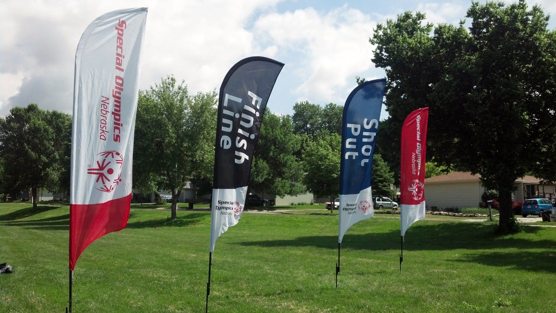 A row of flags with one that says finish line
