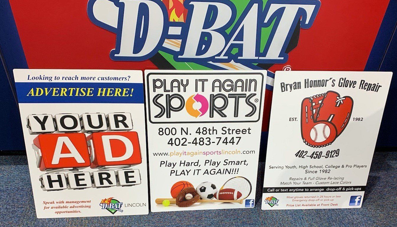 A group of signs for debate sports are displayed