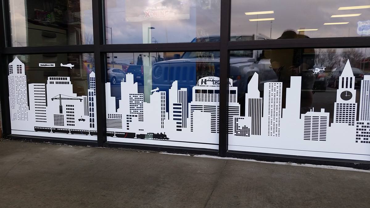 A window with a city skyline on it
