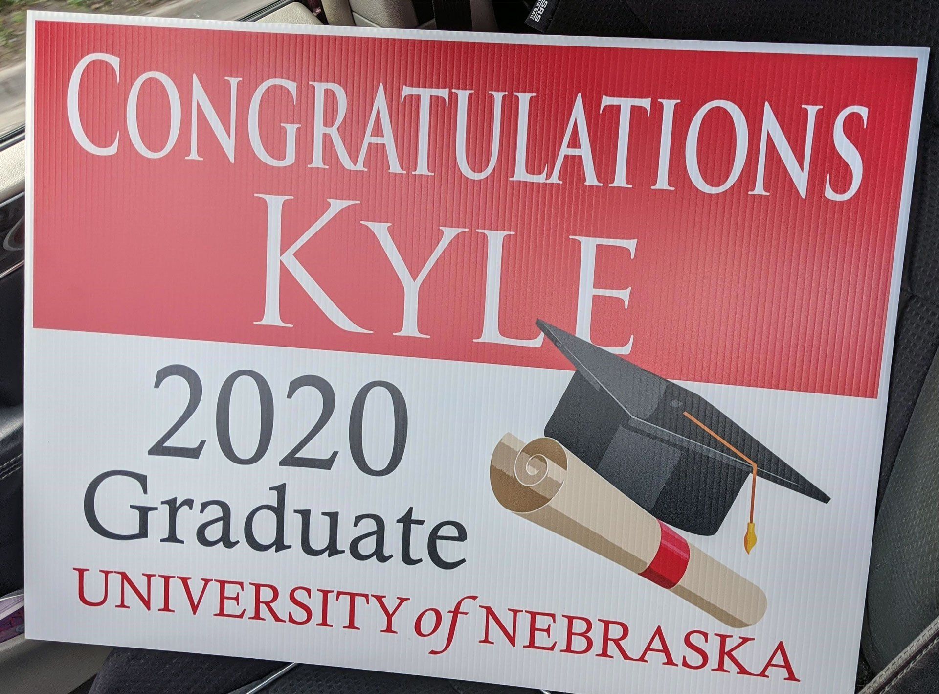 A sign that says congratulations kyle 2020 graduate university of nebraska
