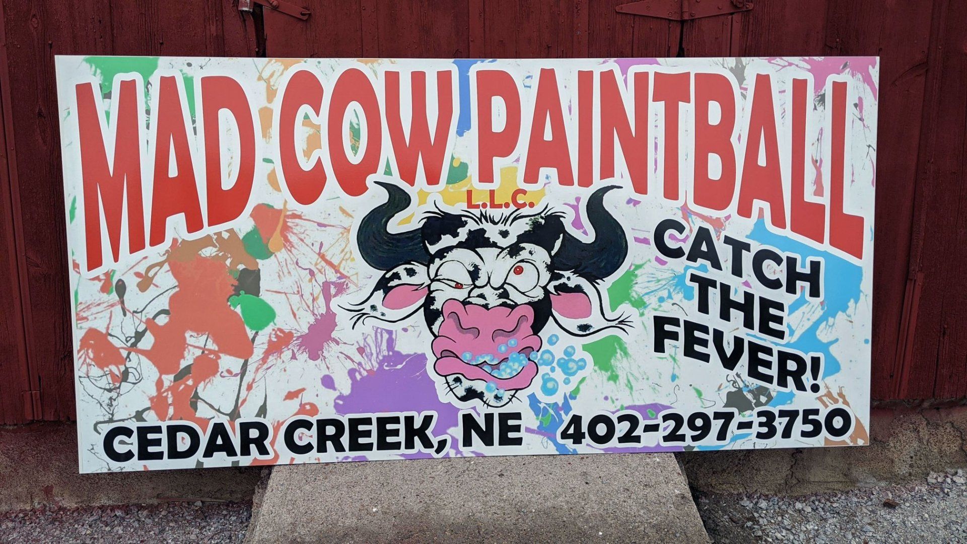 A sign for mad cow paintball in cedar creek ne