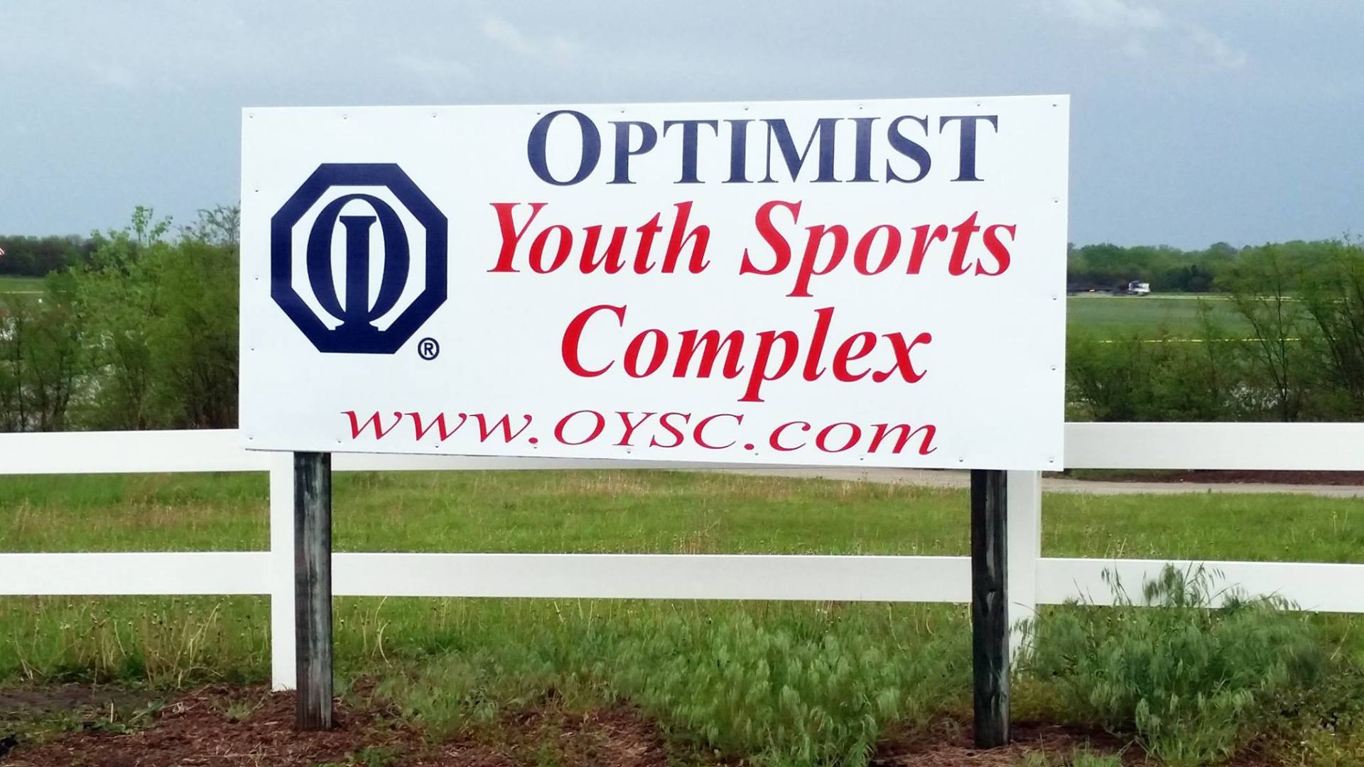 A billboard for the optimist youth sports complex