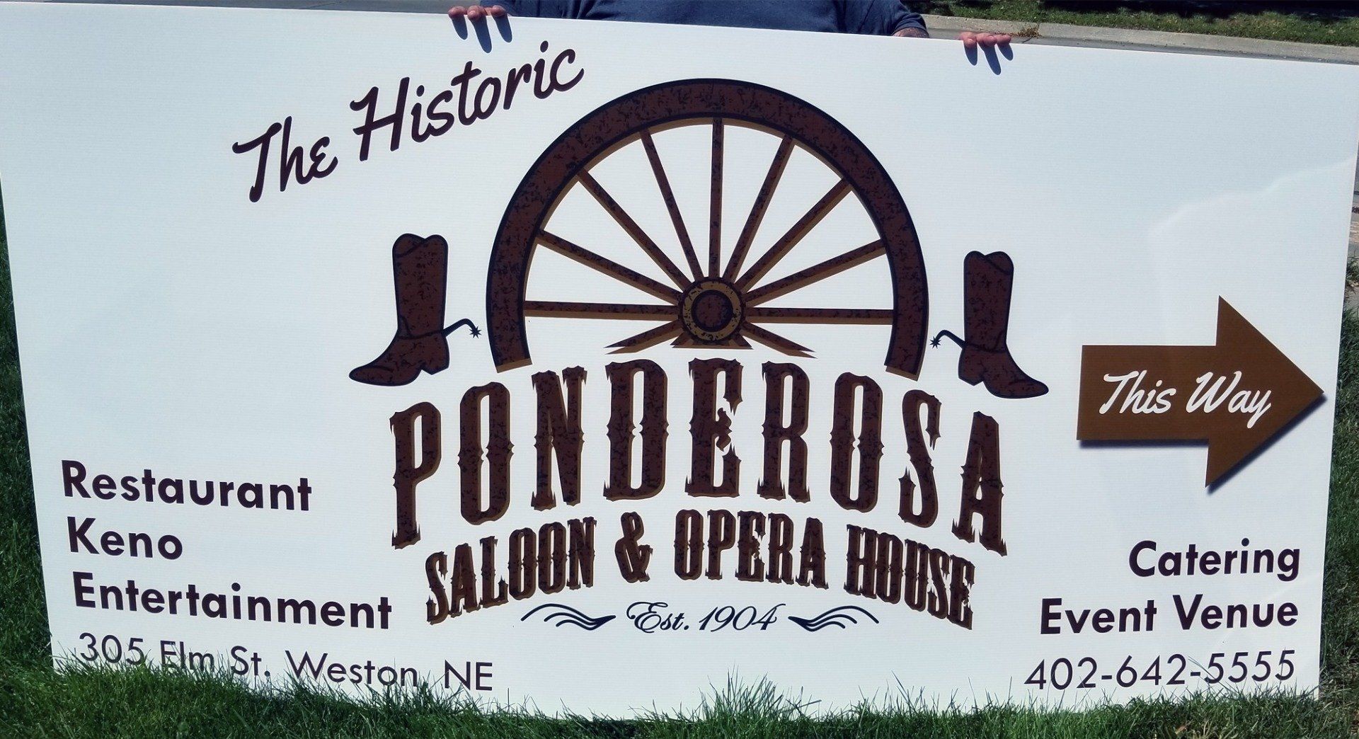 A sign for the historic ponderosa saloon and opera house