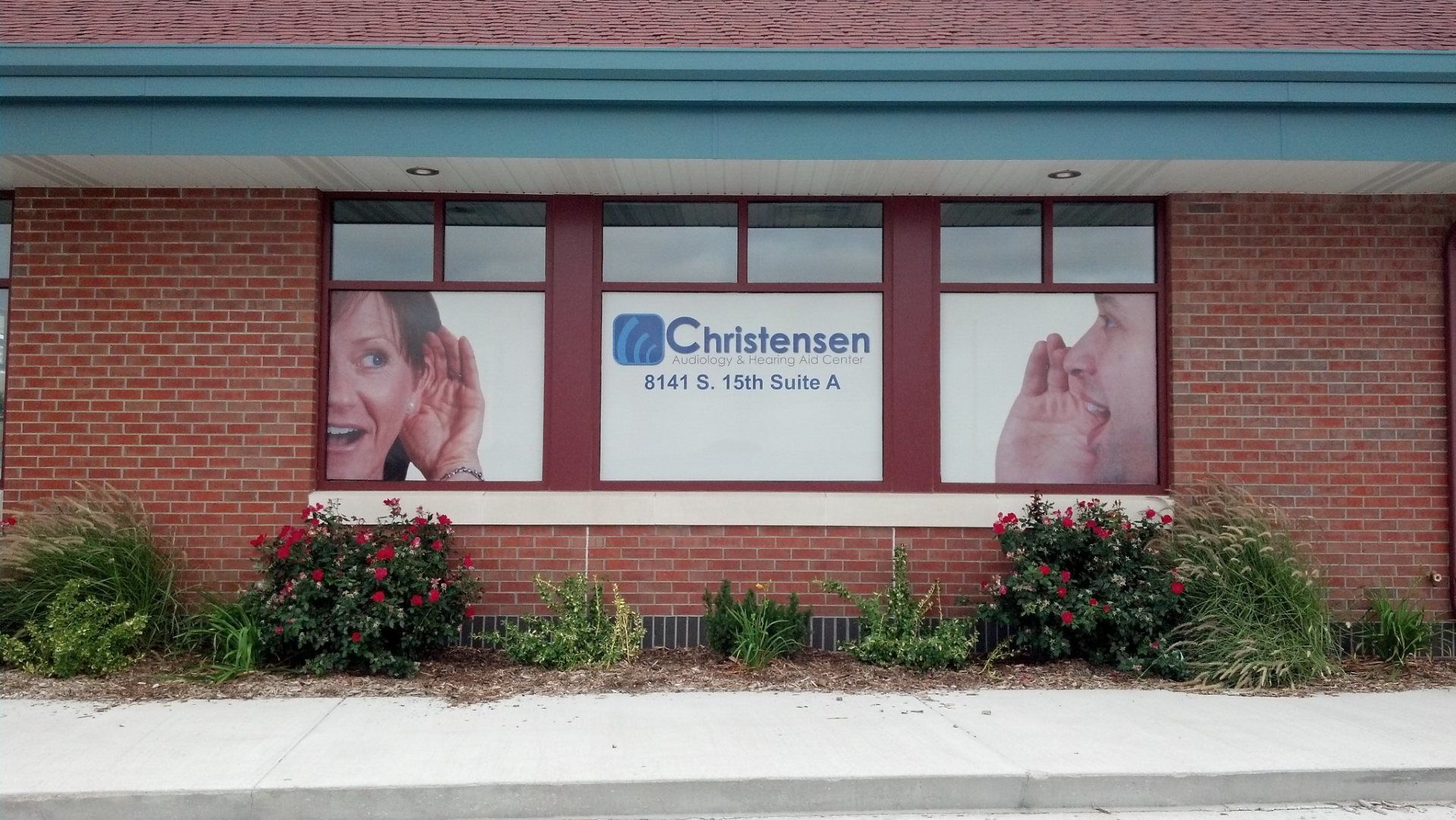 A brick building with a window that says christensen on it