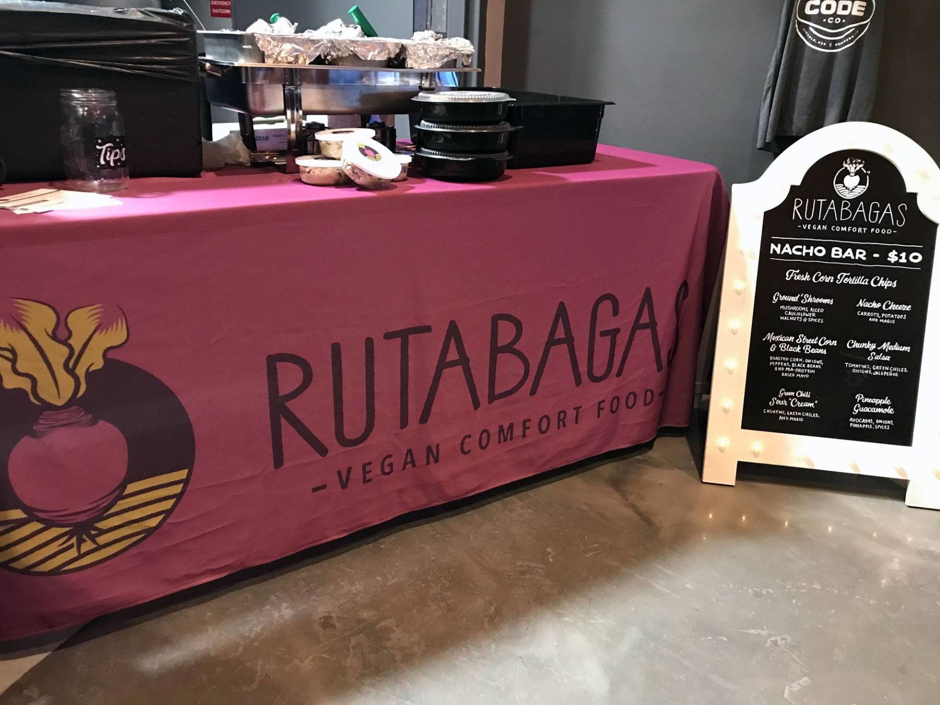 A pink table cloth with the word rutabaga on it