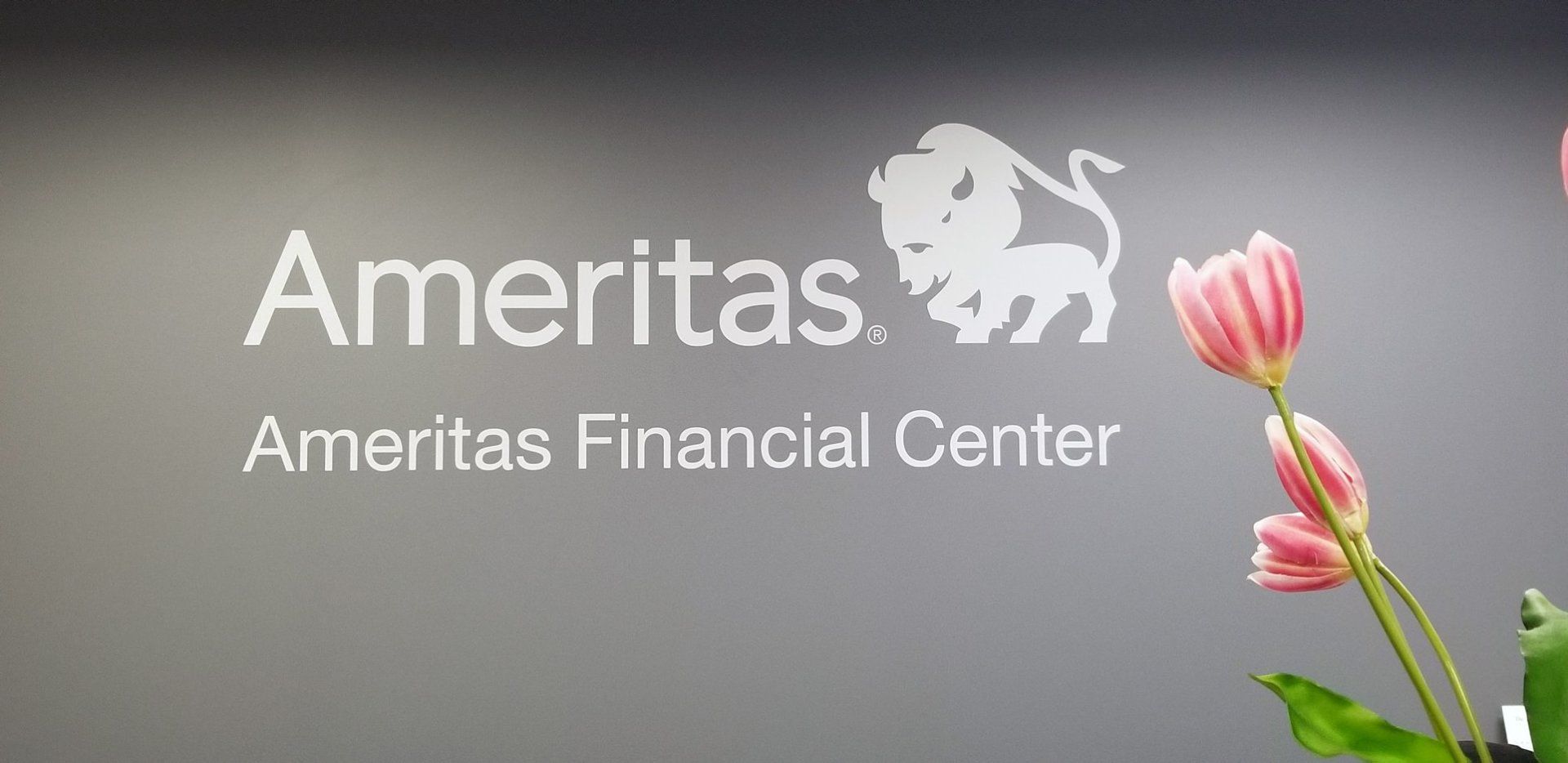 A sign for ameritas financial center with a lion on it