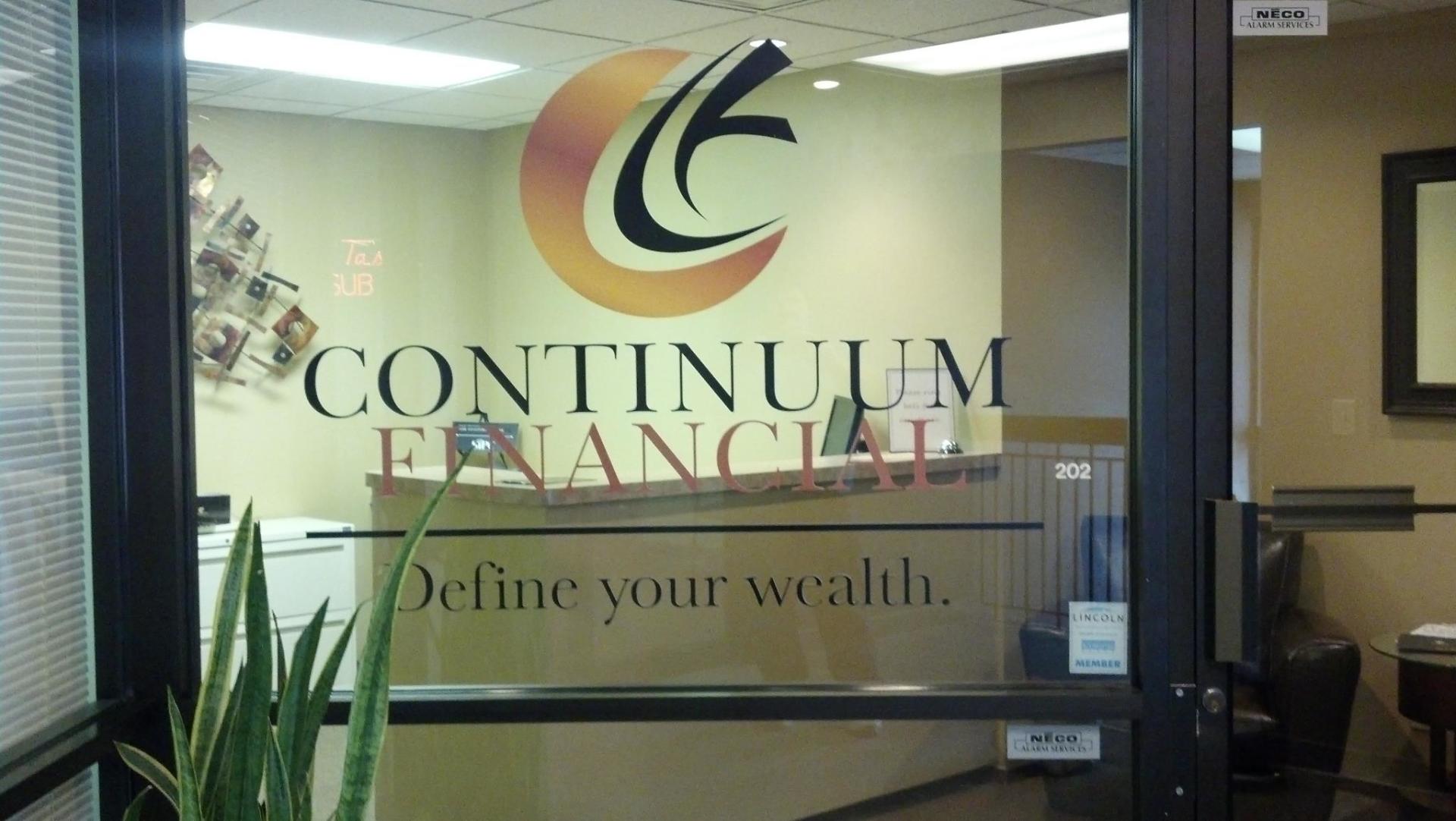 A door that says continuum financial define your wealth