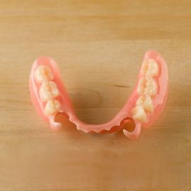 Flexible Dentures — Flexible Denture On Table in Pinellas Park, FL