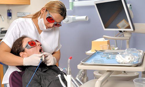 Patient undergoing excellent cosmetic dentistry services in Avon, NY