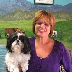 Woman Carrying Her Dog | Lenoir, NC | All God's Creatures Great & Small