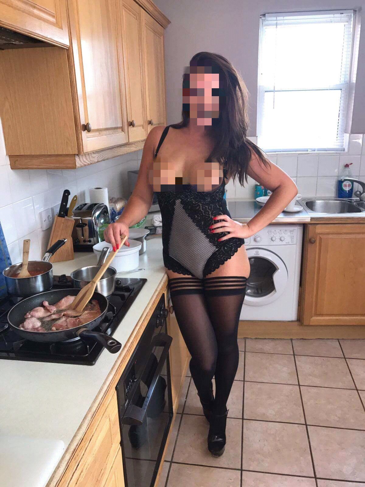 Breakfast in Bed entertainer cooking a full English breakfast in sexy lingerie for a stag party. Epic Moments UK's Breakfast in Bed & Wake-Up Stripper Call service is available in Cardiff, South Wales with lingerie, topless and nude breakfast options.