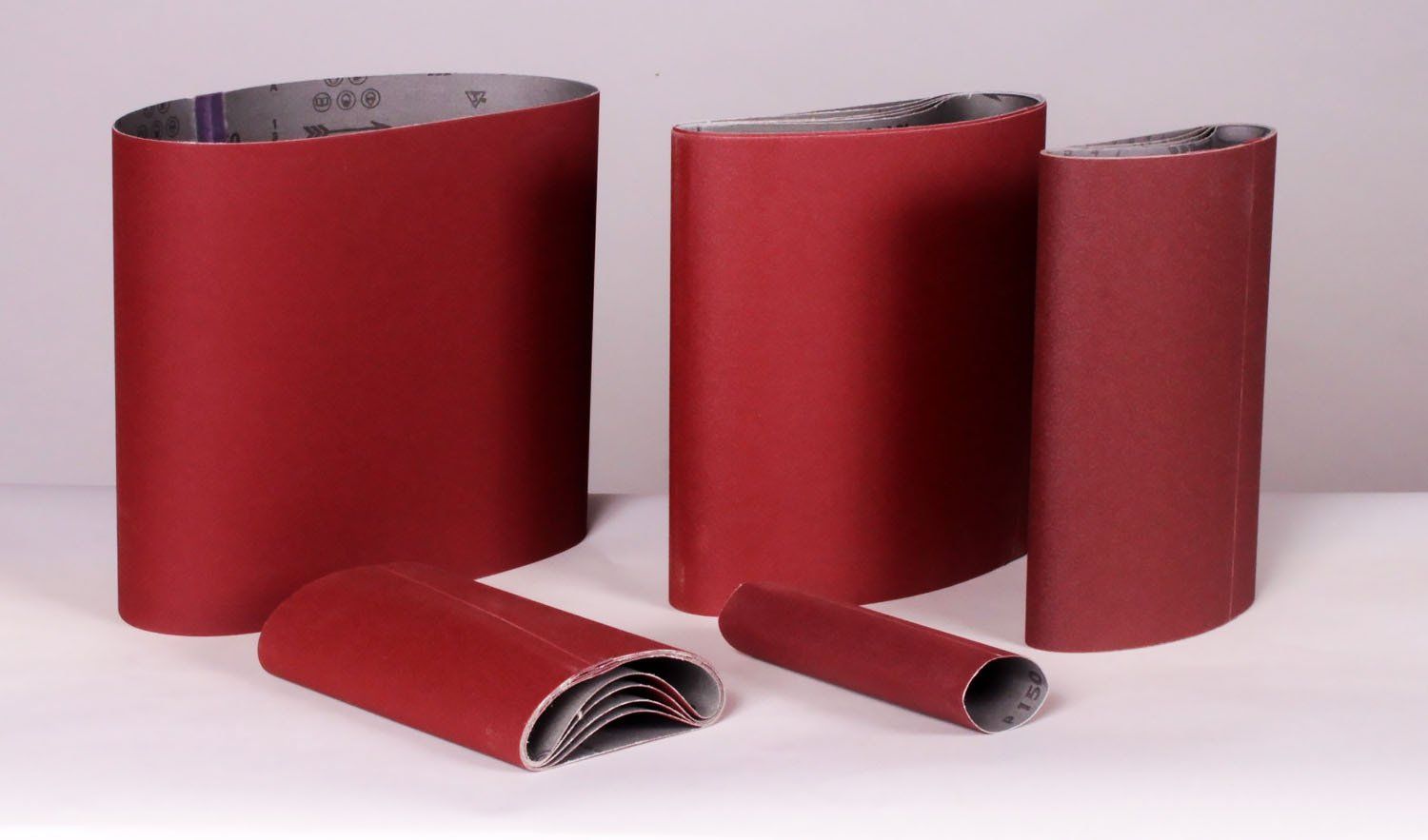 Sand-Rite J-Weight sanding sleeves for pneumatic pump drum sanders.