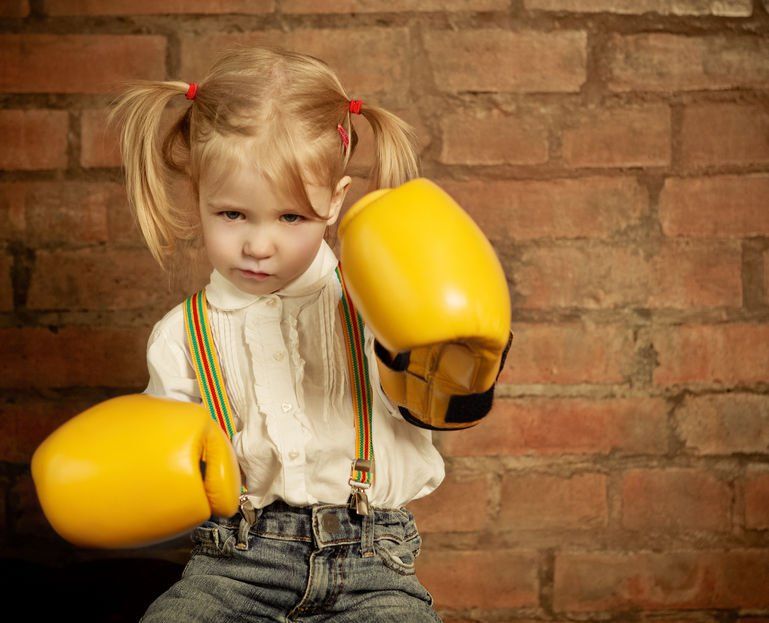 Little girl with boxing gloves