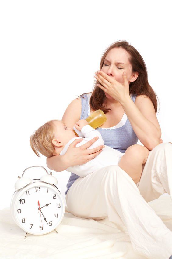Tired mom holding a baby