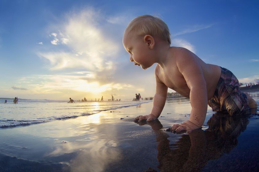 Baby looking at the beach