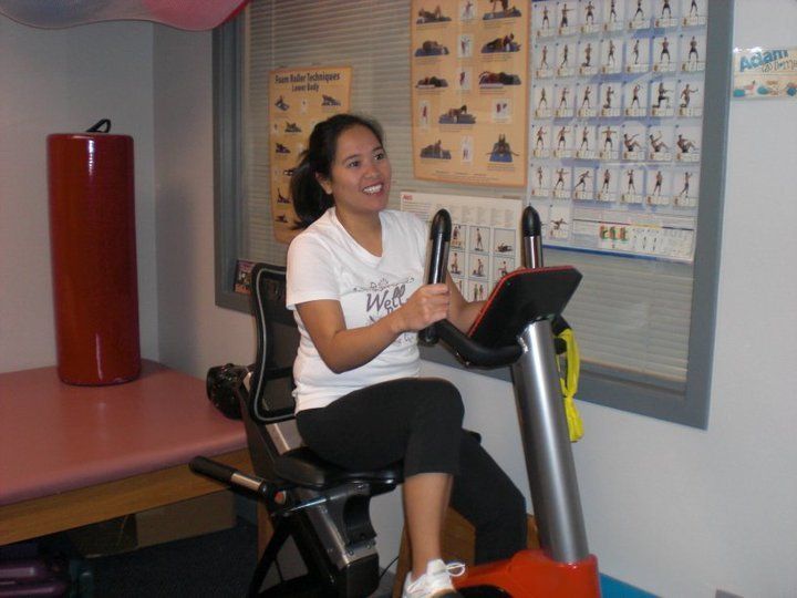 Woman riding a stationary bike - physical therapy in Lynnwood, WA Woman riding a stationary bike - physical therapy in Lynnwood, WA