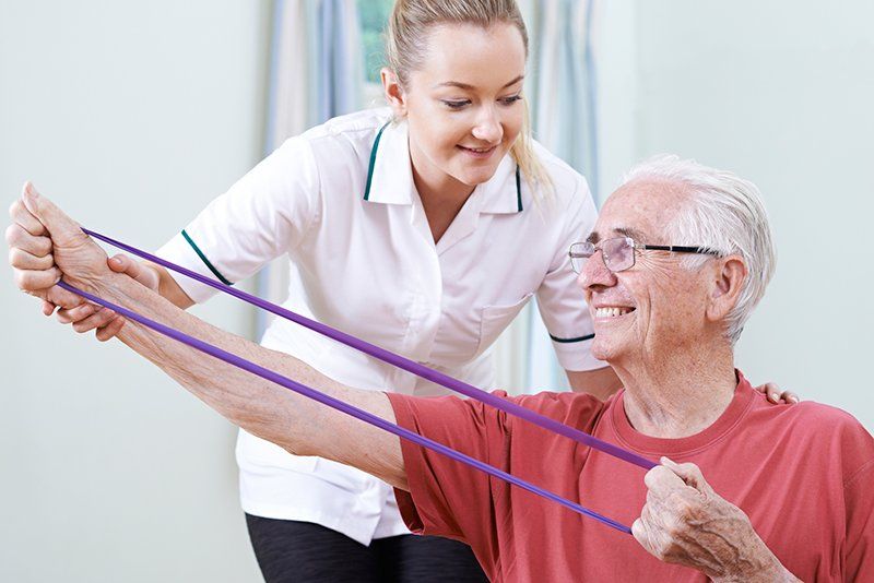Carpal Tunnel — Senior Man Using Resistance Band in Lynnwood, WA