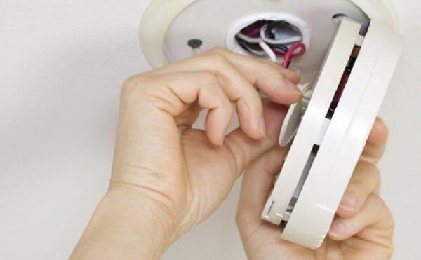 Fixing Smoke Alarm — Electrician in Newtown, QLD Fixing Smoke Alarm — Electrician in Newtown, QLD