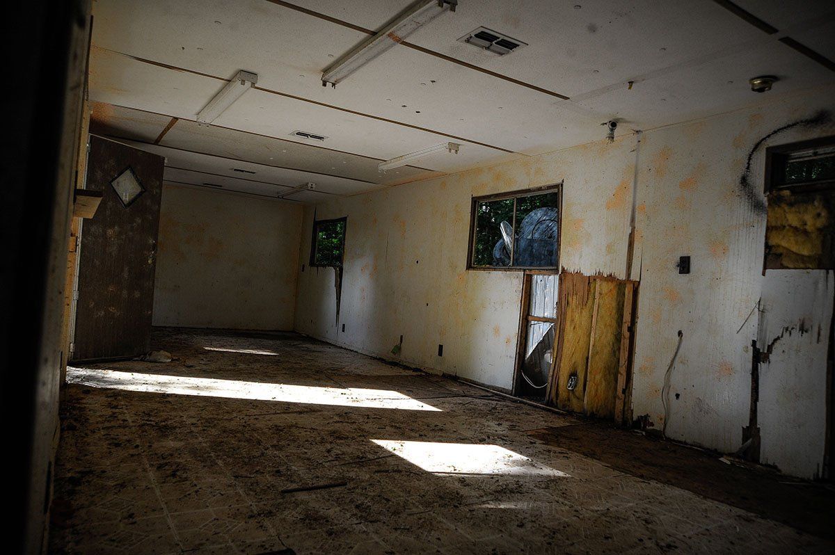 Domination Field - Inside the Building The sun is shining through the windows of an abandoned building.