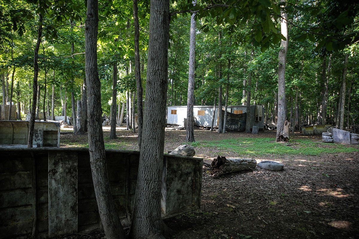 A paintball field in the middle of a forest.