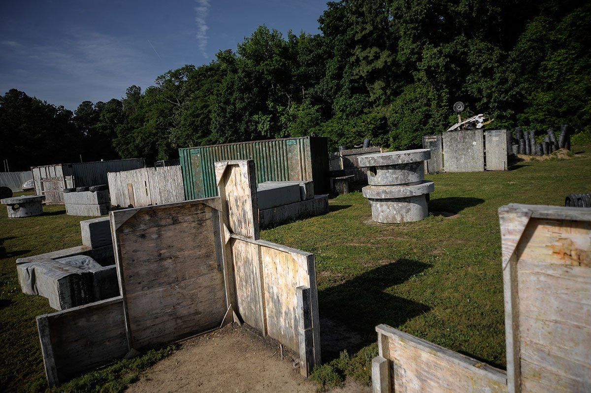 A paintball field with a lot of blocks and trees in the background.