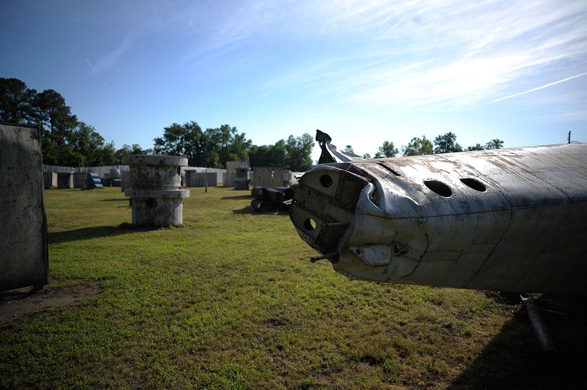 A paintball field with a plane in the foreground