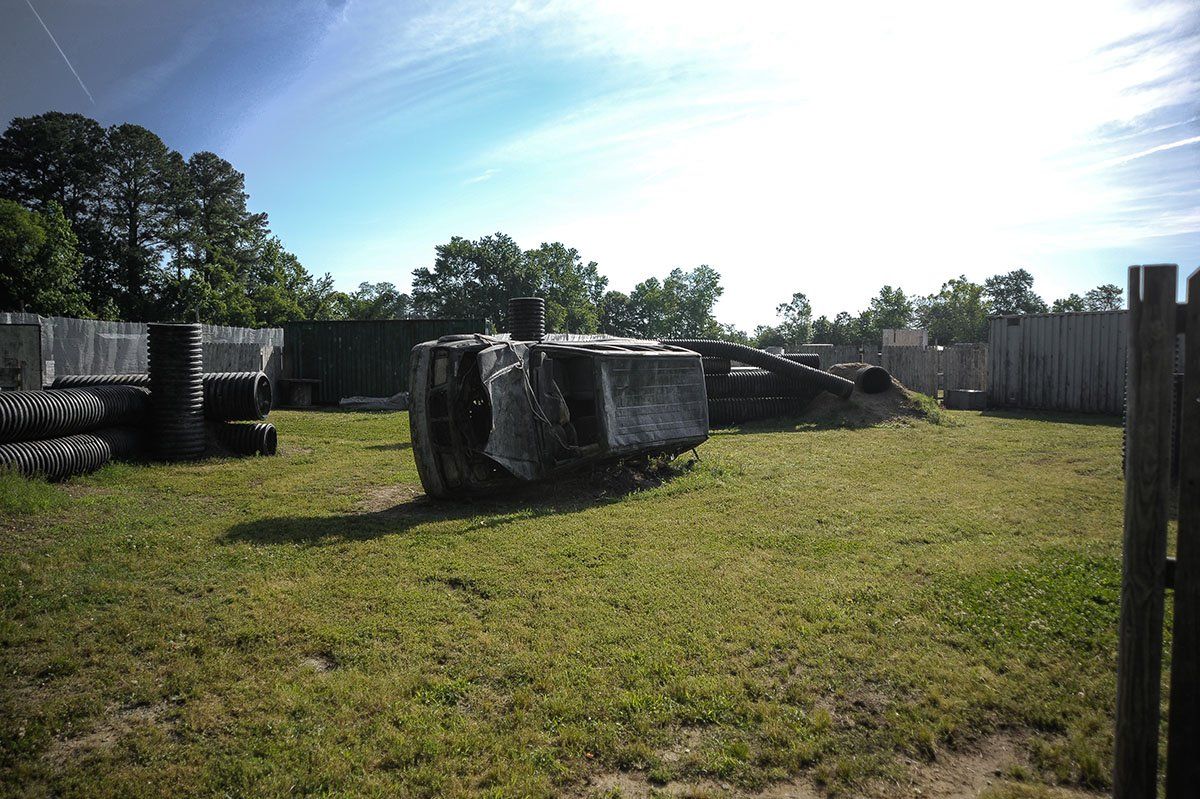A large tractor is sitting in the middle of a grassy field.