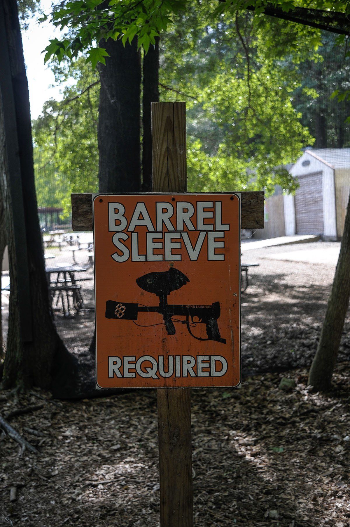 A sign in the woods says barrel sleeve required