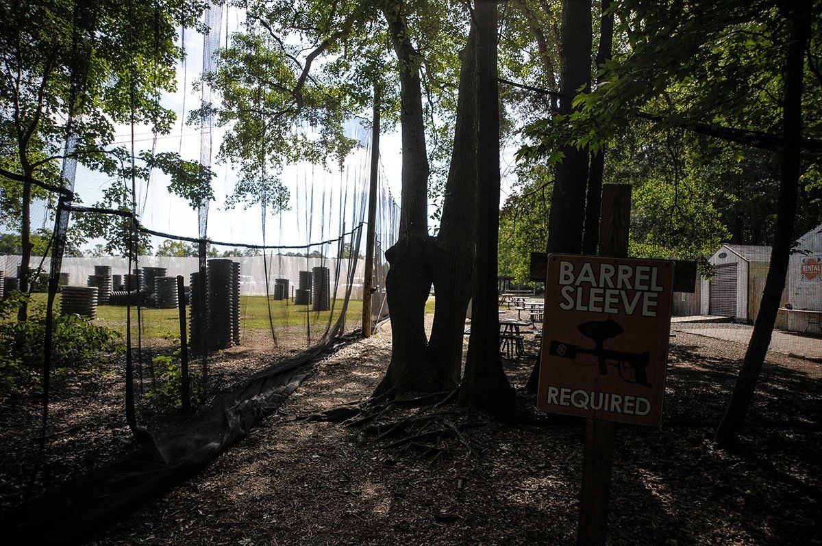 A sign in the woods says barrel sleeve required