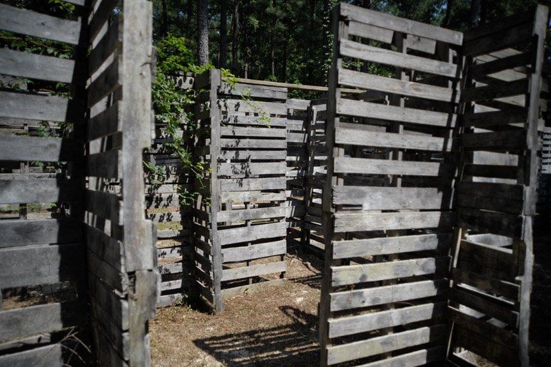 A maze made out of wooden pallets in the woods