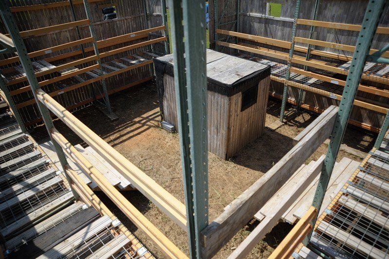 An aerial view of a building with stairs and a shed